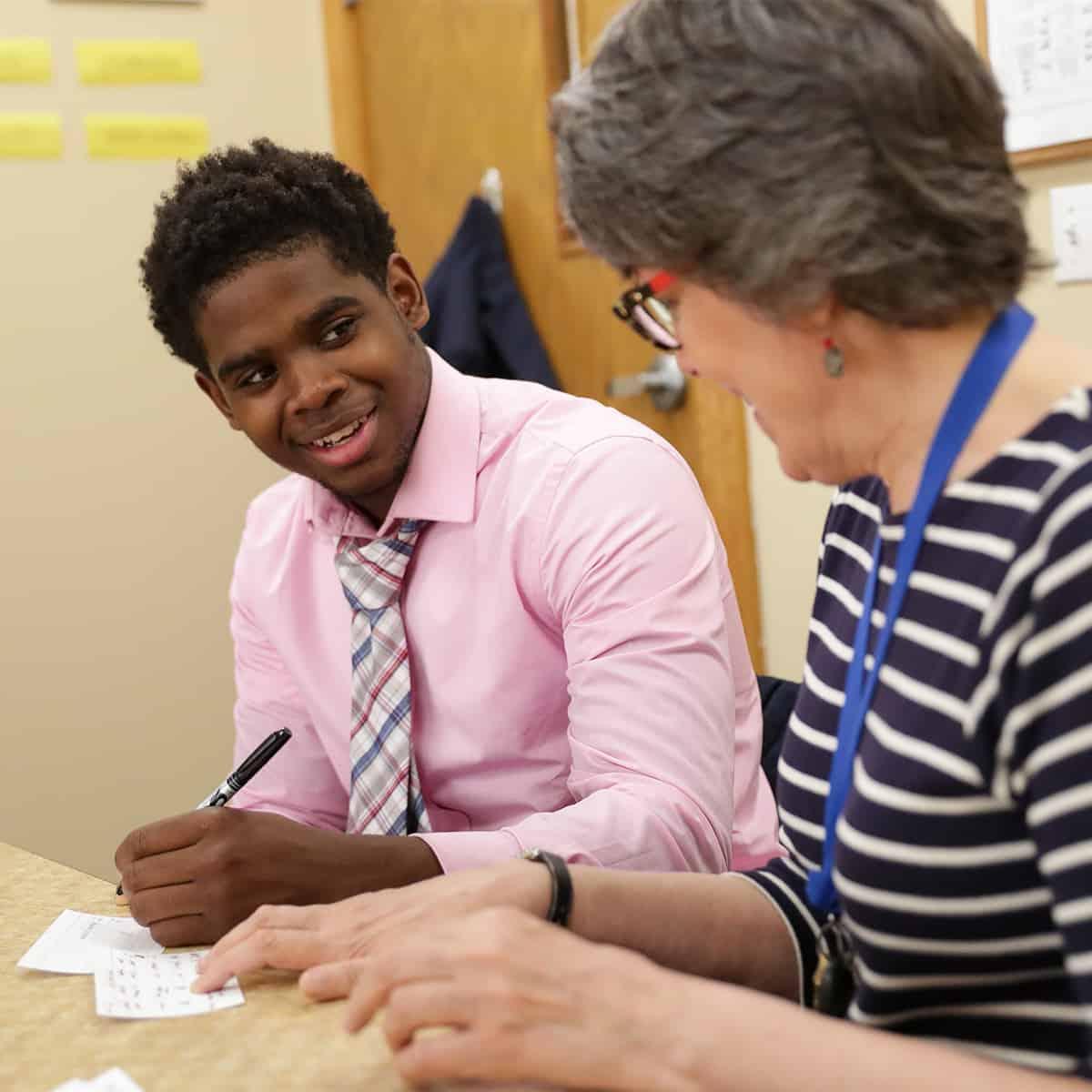 Student working with a learning specialist